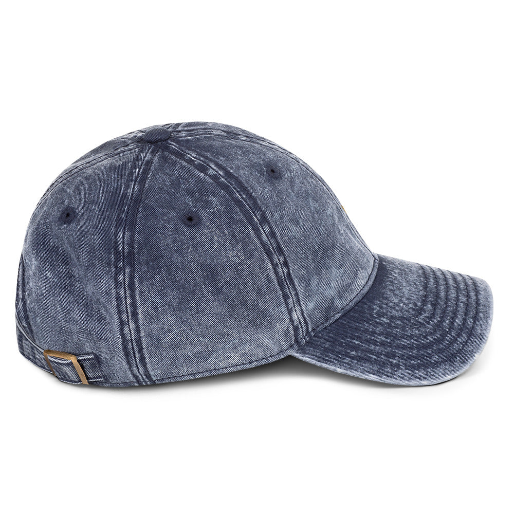 The Mark Heritage Cap in navy cotton twill with antique-brass buckle, right-side view